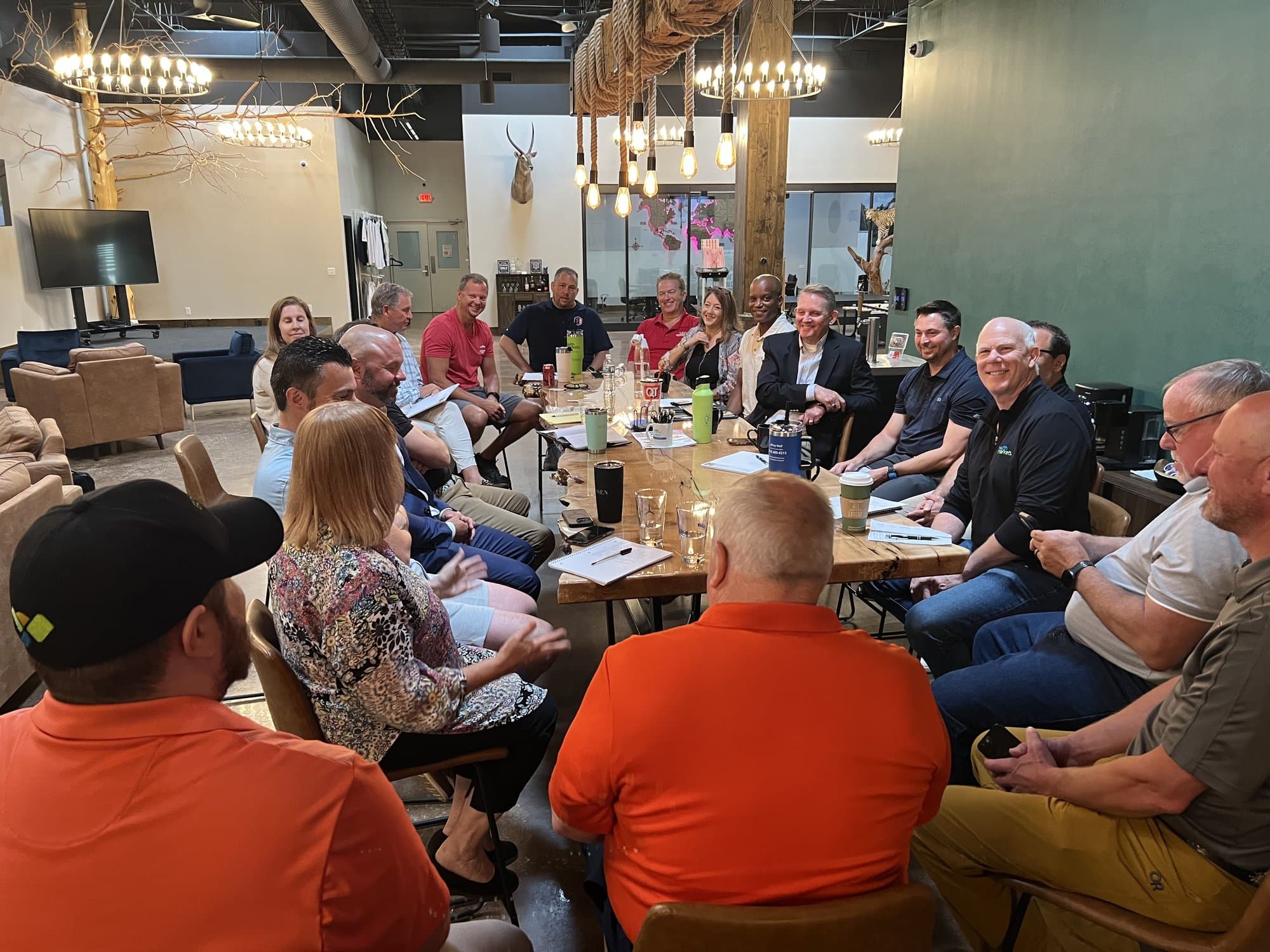 Members talking around a clubhouse table